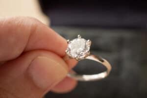 hand-hold-beautiful-jewelry-diamond-ring